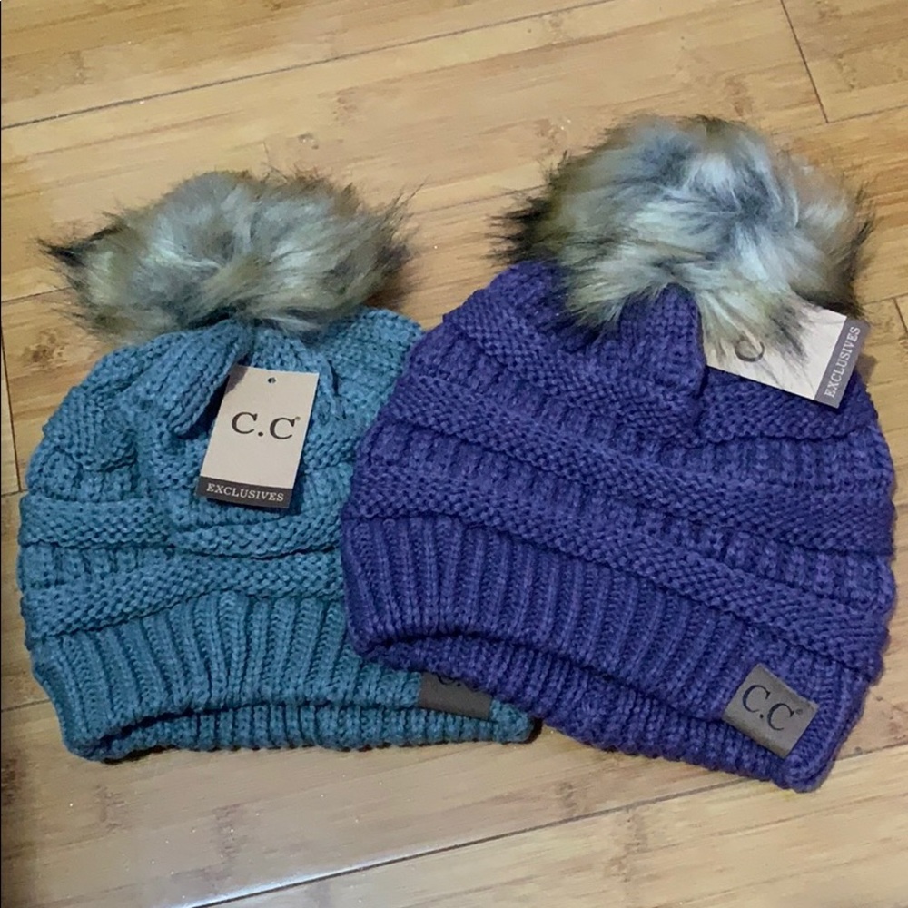 2 hats with pom